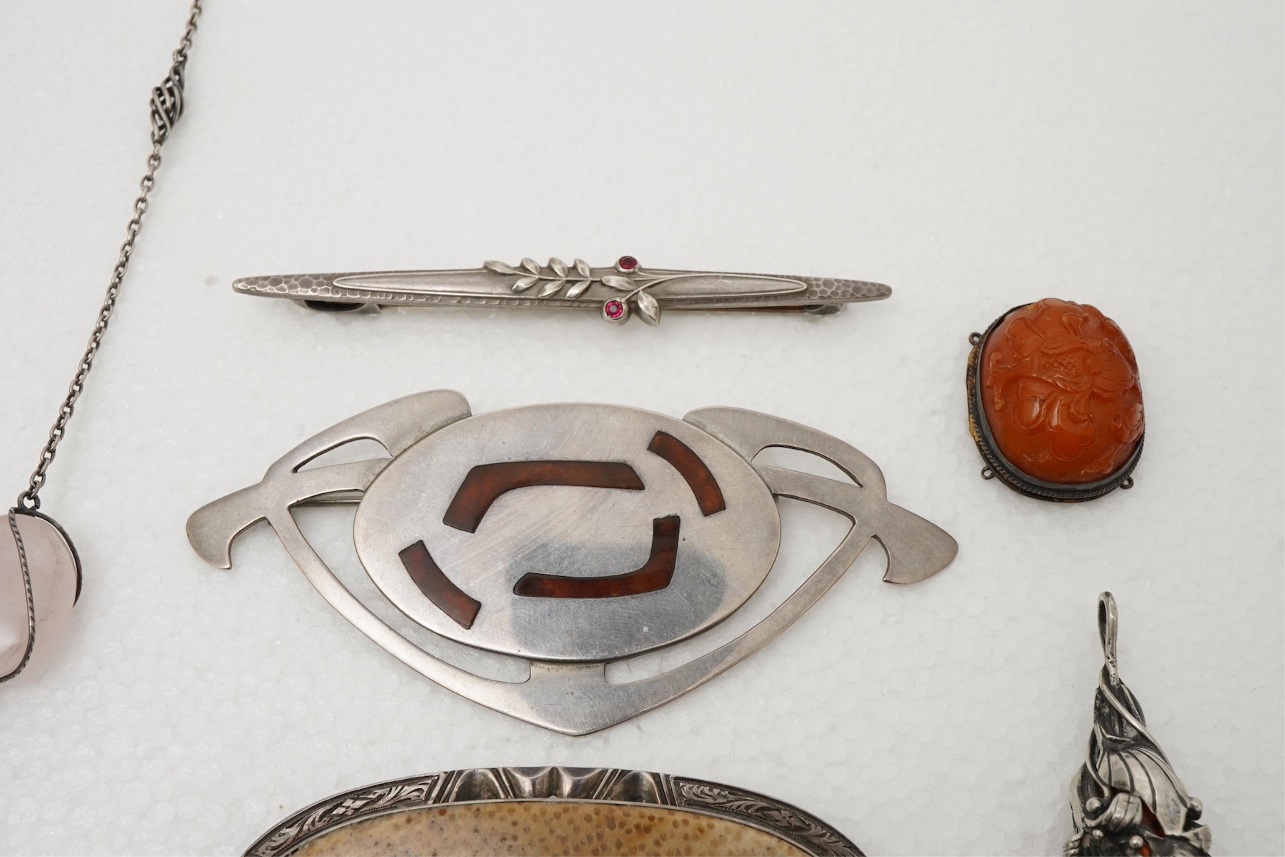 A collection of Arts & Crafts jewels including a pair of silver earrings by Georg Jensen